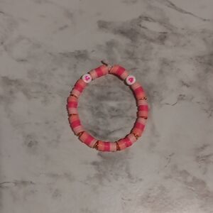 Handmade pink and gold bracelet.
